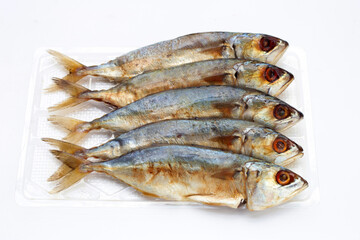 Salted fish on white background.