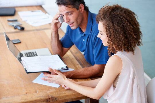Business, documents and team in a meeting with laptop for planning, idea and solution in office. Admin, report and people in creative collaboration for startup, budget and company, growth and goal