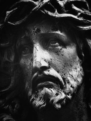 Close up fragment of old statue of Jesus Christ crown of thorns. Black and white image.