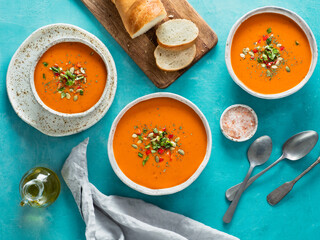 Gaspacho soup on blue, top view
