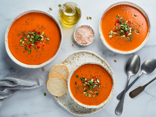 Gaspacho soup on light marble, top view