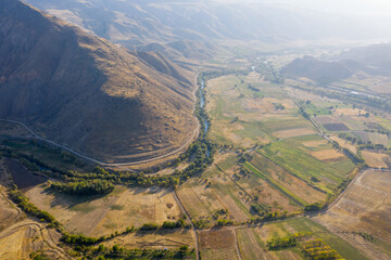 Aerial view of Arpa river valley on sunny autumn day. Outskirts of Yeghegnadzor, Vayots Dzor Province, Armenia.