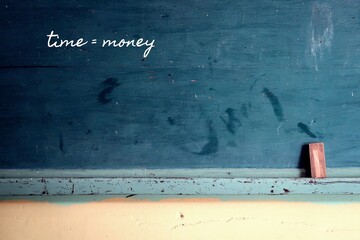 school chalkboard background with handwritten handwriting text TIME = MONEY, meaning time is...