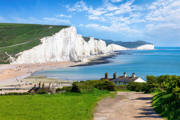 The Seven Sisters Chalk cliffs and the coastguard cottages during a eraly summer day, Seaford, East...