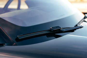 Close up of windshield wiper of a luxury car - obrazy, fototapety, plakaty