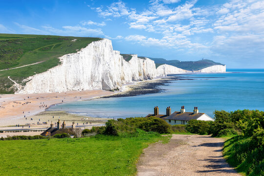The Seven Sisters Chalk cliffs and the coastguard cottages during a eraly summer day, Seaford, East Sussex, England
