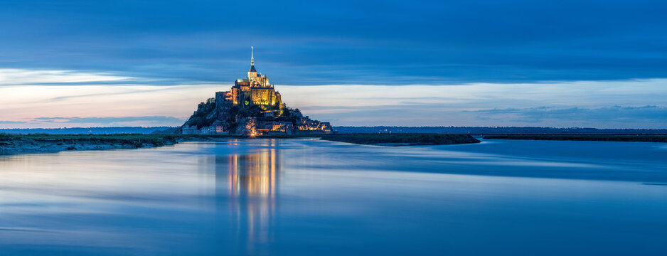 Panoramic view of Mont-Saint-Michel tidal island at dusk, Normandy, France