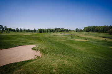 Golf course in spring in sunny weather