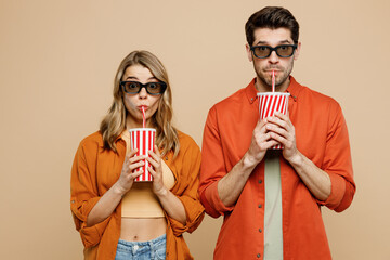 Young couple two friends family man woman in 3d glasses wearing casual clothes watch movie film...