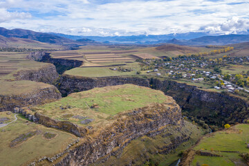 Naklejka premium Drone view of Loriberd fortres and Amrakits village on autumn day. Lori Province, Armenia.