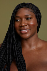 Portrait of smiling woman against green background