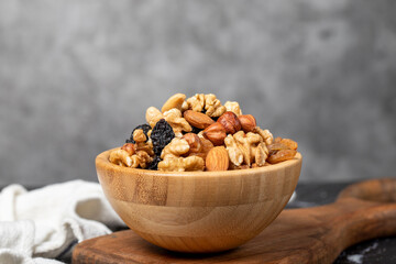 Mixed raw nuts. Special mixed nuts in bowl. Hazelnut, almond, cashew, pistachio, dried blueberry. Superfood. Vegetarian food concept. healthy snacks. Close up