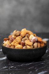 Mixed nuts. Special mixed nuts in bowl. Hazelnut, almond, cashew, pistachio, dried blueberry. Superfood. Vegetarian food concept. healthy snacks. Close up