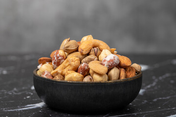 Mixed nuts. Special mixed nuts in bowl. Hazelnut, almond, cashew, pistachio, dried blueberry. Superfood. Vegetarian food concept. healthy snacks. Close up