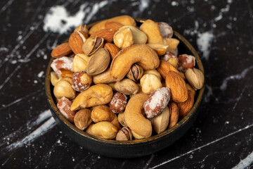 Mixed nuts. Special mixed nuts in bowl. Hazelnut, almond, cashew, pistachio, dried blueberry. Superfood. Vegetarian food concept. healthy snacks. Close up