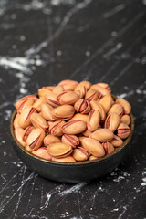 Pistachio nut. Pistachio in shell in bowl. Superfood. Vegetarian food concept. Healthy snacks