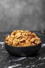 Walnut. Walnut kernel in bowl. Superfood. Vegetarian food concept. Healthy snacks. Close up