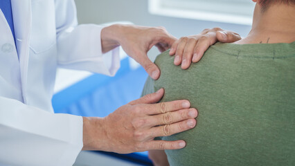 Professional massage therapist physiotherapy worker rehabilitation physiotherapy man at work with patient man client at clinic
