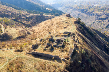 Aerial view of remains of Havuts Tar monastery on sunny autumn day. Khosrov Reserve, Armenia.