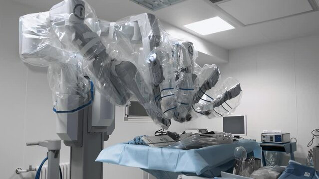 Operating room in modern clinic equipped with advanced robotic tools. High medical technology in invasive laparoscopic surgery and healthcare, da Vinci system