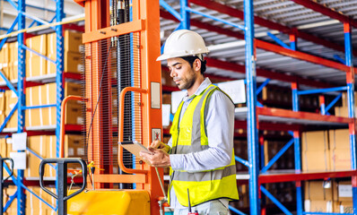 Portrait engineer worker labor man use tablet shipping order detail check goods and supplies on shelves with goods background inventory in factory warehouse.logistic industry and business export