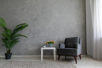 interior coffee table with armchair and flowers