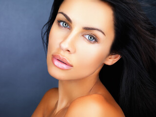 Beauty, skincare and healthy clean skin of a beautiful young woman with gorgeous blue eyes. Face...