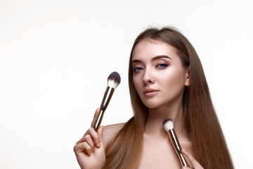 Obraz premium attractive woman with make-up brush for powder