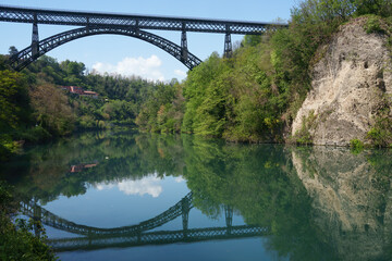 Fototapeta na wymiar Iron bridge over Adda river at Paderno