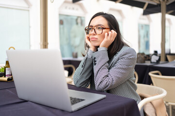 Overworked freelancer woman in stress works at laptop