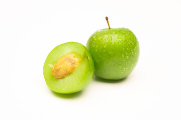 Fresh and green plum on white background