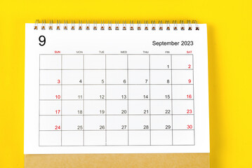 The September 2023 Monthly desk calendar for 2023 year on yellow background.