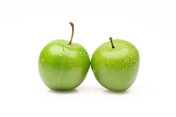 Fresh and green plum on white background