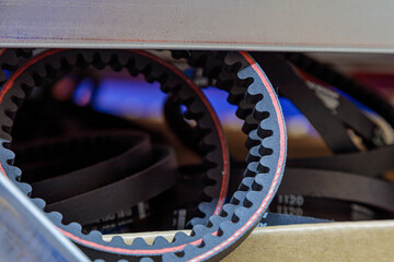 Toothed drive belt for a compressor in a box in stock. Close-up.