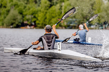 two male athlete kayaker on kayak single rowing kayaking championship race, sports summer games