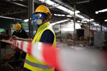 Restricted area, officials employ white and red stripes to block the area where a chemical leak is...