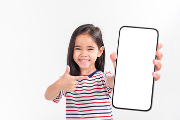 Fototapeta na wymiar Asian little girl holding smartphone mockup of blank screen and smiling on white background.