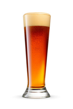 Pilsner glass of fresh dark brown beer with cap of foam isolated. Transparent PNG image