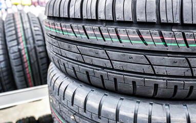 Summer tires stacked up for sale in a superstore
