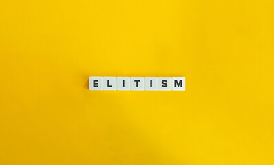 Elitism Word on Block Letter Tiles on Yellow Background. Minimal Aesthetics.