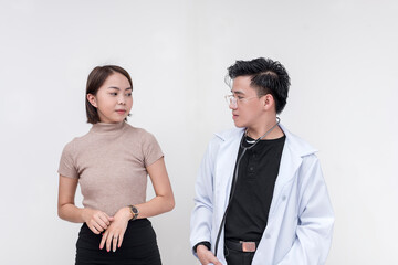 Portrait of a serious and impassive couple, medical student, intern, doctor, looking at each other. Isolated on a white background. - obrazy, fototapety, plakaty