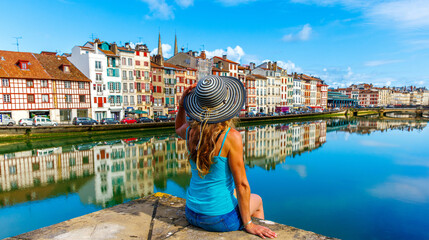 Woman tourist in Bayonne- France, basque country - obrazy, fototapety, plakaty