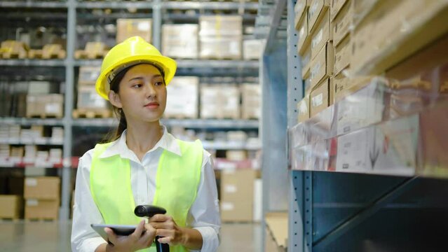 Female employee worker scanning products on shelves in warehouse, working with scanner for merchandise distribution. Young adult reviewing stock logistics before order shipment in depot.