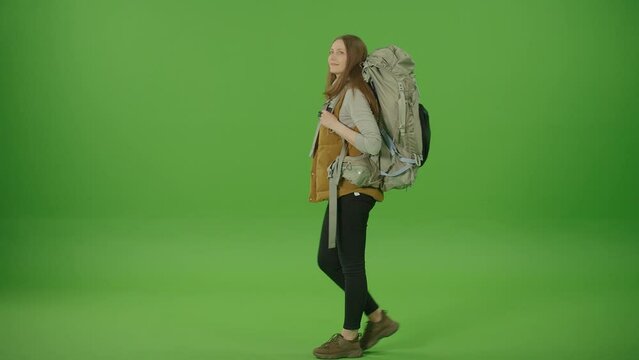 Green Screen. Chroma Key. Young Woman Tourist Commuter with Big Travel Backpack Passing Admire the View. Female on Vacation Trip.