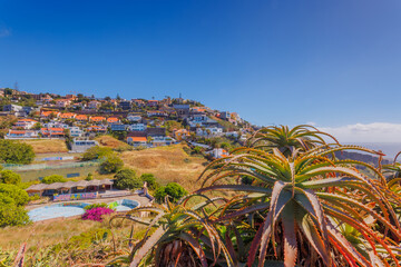 Madeira landscape, settlements built on high cliffs or in the hillsides rising steeply right from...