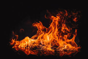 Fire flames on black background. Bright and hot fire burning on ground. Generative AI