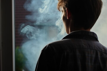 Back of smoking alone teenager boy. Generative AI.