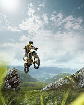 Motocross competition. Man, motorcycle rider in full moto equipment riding hills, jumping with enduro bike. 3D render background. Concept of motosport, speed, hobby, journey, activity