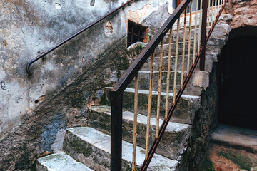 Old worn stone and concrete staircase in town of Lovran in Croatia