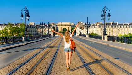 Fotobehang Happy woman tourist visiting Bordeaux city in France- Nouvelle aquitaine © M.studio